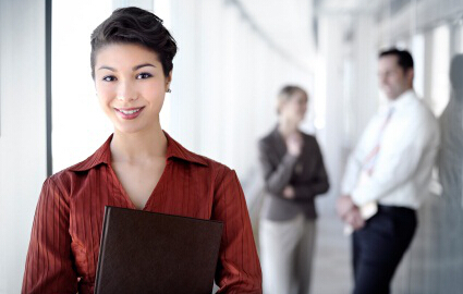 a young good looking chinese business woman standing out from the croud